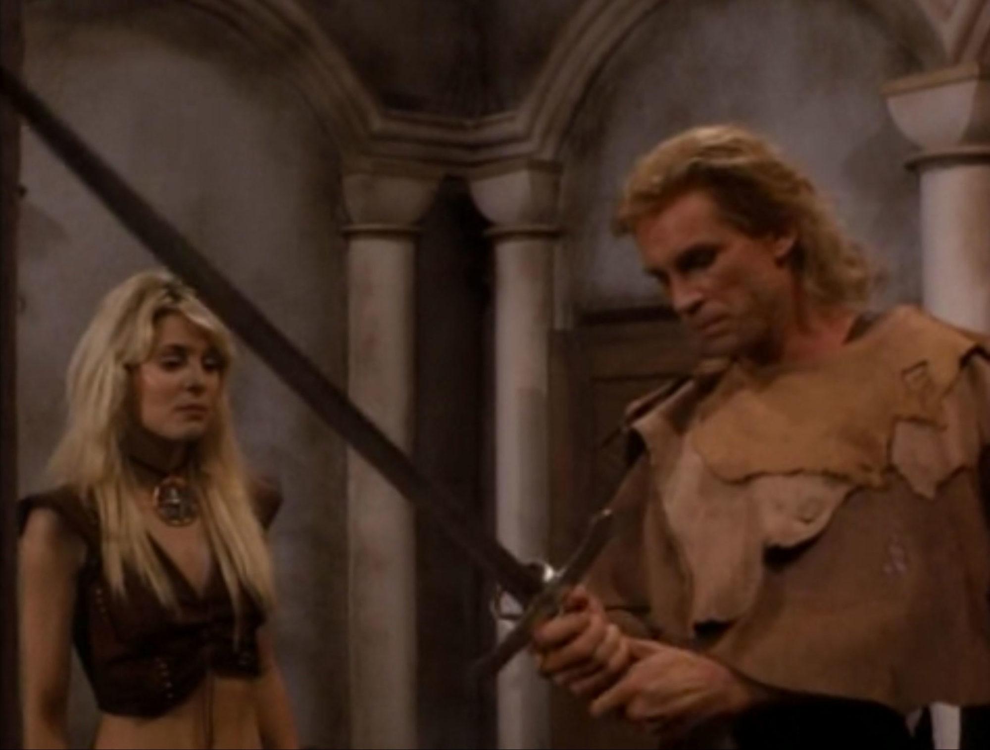 Rick Hill and Maria Ford in Deathstalker IV: Match of Titans