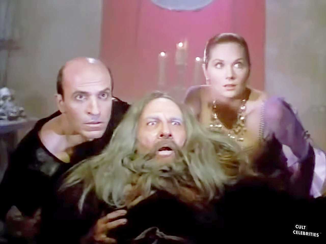 Terri Treas, Agustín Salvat and Thom Christopher in Deathstalker and the Warriors from Hell (1988)